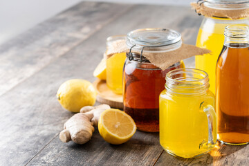 Colorful Kombucha Jars and Bottles on wooden table	