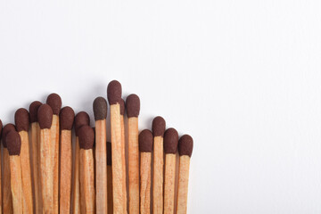 Wooden match isolated on white background, space fo text