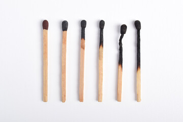 Burnt matches isolated on white background. Different stages of match burning Burnt matches.