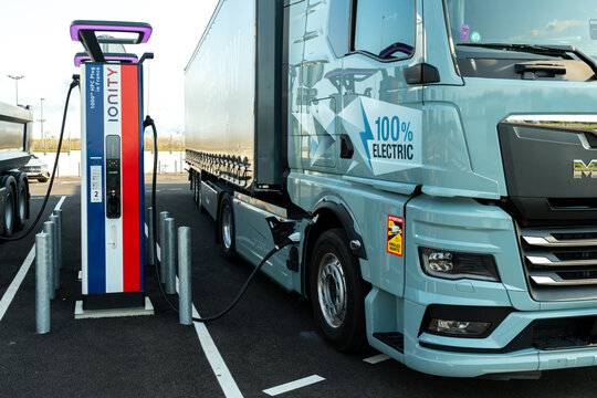Modern electric truck connected to a charging station highlighting green transport technology and efficient charging infrastructure for battery powered vehicles. France &ndash; August 6, 2025