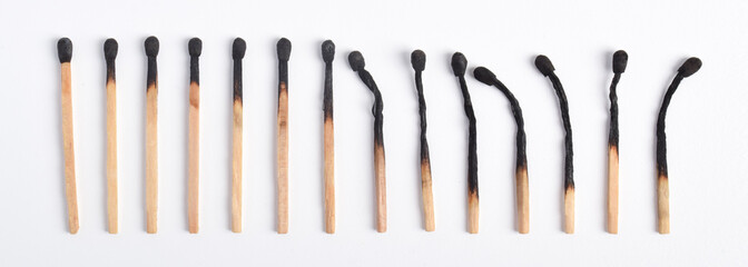 Burnt matches isolated on white background. Different stages of match burning Burnt matches.