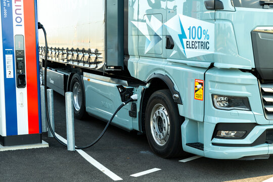Electric truck at roadside charging point demonstrating the future of electromobility with efficient battery charging for clean energy and zero emission transport. France &ndash; August 6, 2025