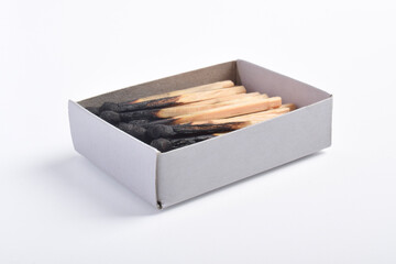 Burning matches in the matchbox isolated on white background. Box of matches.