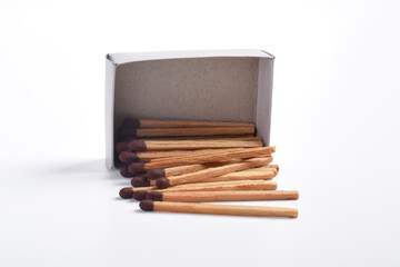 Box of matches isolated on white background, for ignition, safety, and household concept.