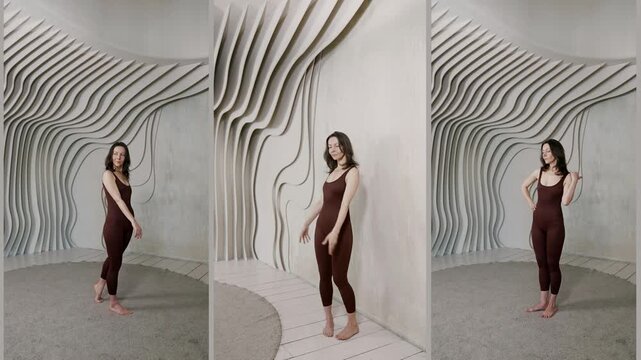 A slender girl teaches posing using body balance. The graceful tilt and free hand movements help to convey lightness and grace.