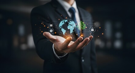 A businessman in a suit holds a holographic globe with digital icons floating above his open palm, symbolizing global technology and connectivity.