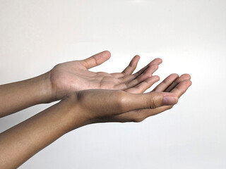 Close-up of two open empty hands held upwards against a clean white background, symbolizing offering or receiving