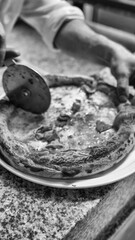 Inside view of a bustling pizzeria with delicious pizzas fresh out of the wood-fired oven