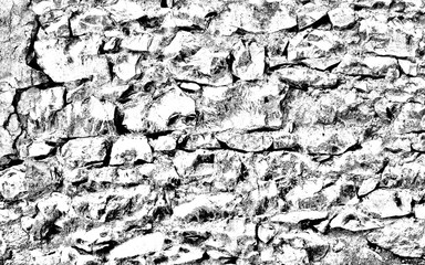 black and white textured stone wall made of sharp-edged stones