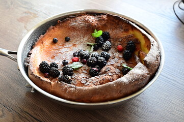 Dutch Baby Dessert with Fresh Fruit, Sugar, and Mint