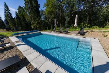 Modern cabins and swimming pool in the Carpathians on a sunny day