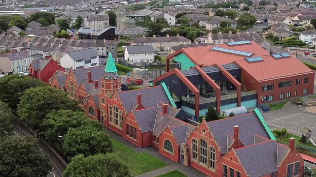 Ysgol Cybi welsh primary school aerial view towards green copper spire in the Holyhead suburb