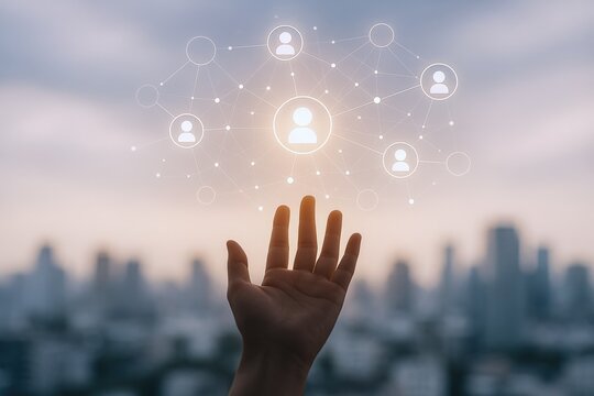 Human Resources Connection: Person's Hand Reaching for a Digital Network of People Icons with Cityscape Backdrop - Powered by Adobe