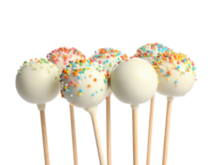 A group of cake pops with colorful sprinkles on top, presented on sticks.