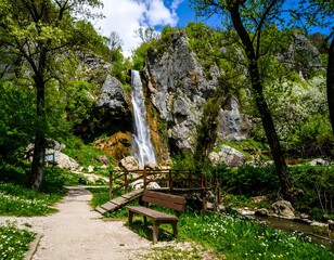 Scenic waterfall, trail, and bench