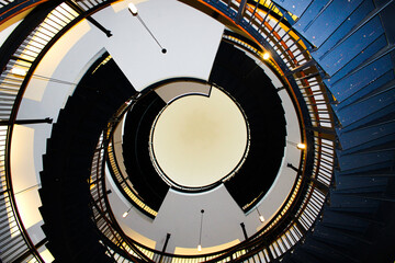 Modern Spiral Staircase with Symmetrical Architecture Viewed from Below