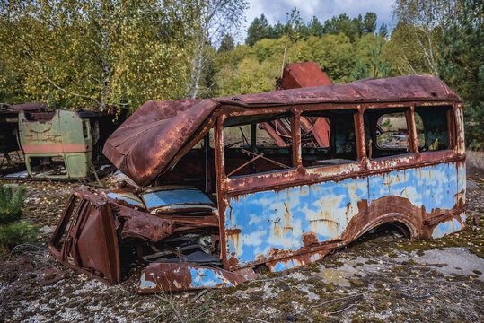 Old bus on a wrecking yard near Illinci village in Chernobyl Exclusion Zone in Ukraine