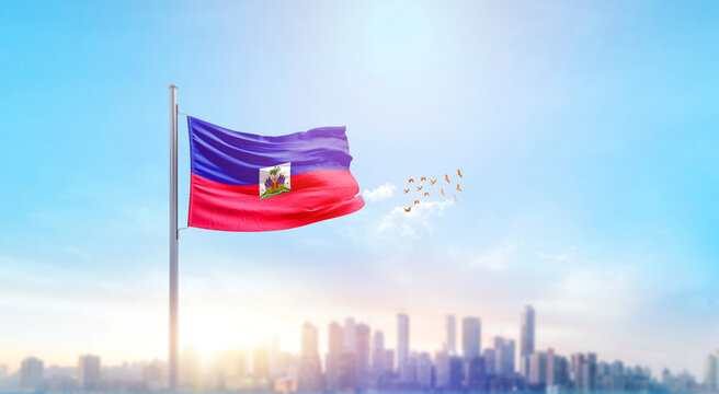 Haiti national flag waving with skyline and buildings. Haitinational flag for independence day.
