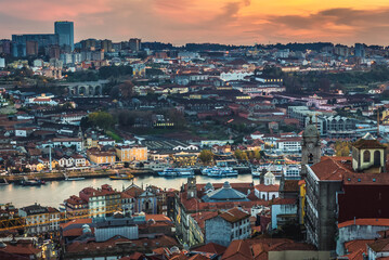 Obraz premium Sunset over Porto city, Portugal. View bell tower of Clerigos Church