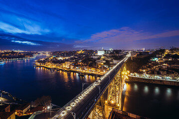 Fototapeta premium Sunset over Porto. View with Dom Luis I Bridge from Serra do Pilar in Vila Nova de Gaia, Portugal