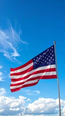 American flag waving in a clear blue sky