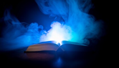 An open book glows with mystical blue light and smoke