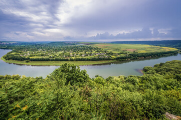 Aerial view of Dniester River between Moldova, view from hill near Soroca and Ukraine, Tsekynivka village