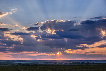 Obraz premium Sunset over fields in rural area of Romania