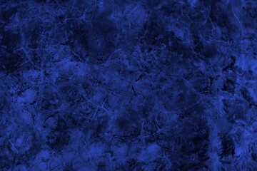 Close-up view of a blue textured wall showing rough patterns and intricate shadow details, offering a visually appealing background texture for versatile creative uses.