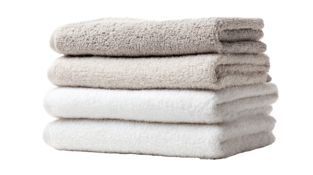 Stack of soft towels in neutral colors on a white isolated background.
