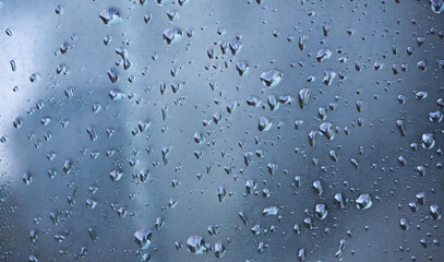 Close Up Shot of Raindrops on Window Highlighting Texture and Transparency of Water Droplets