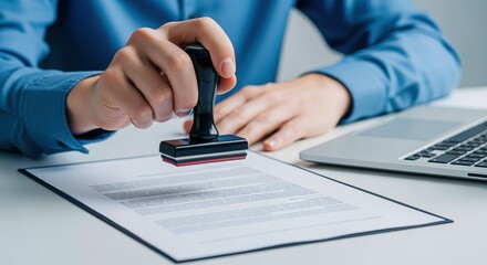 Stamping Official Documents: Businessman Sealing Approval with Rubber Stamp on Contract or Agreement, Ensuring Compliance and Validation