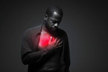 Black and white portrait of a black man with red heart pain