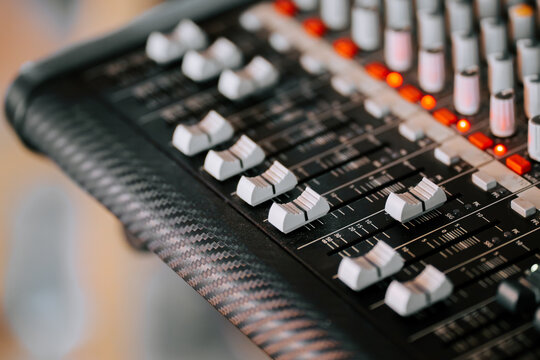 Mixing console in a modern studio during a recording session with musicians collaborating - Powered by Adobe