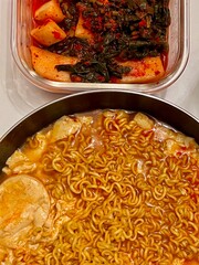 Spicy Shin ramyeon with bold, flavorful broth, served alongside fresh kimbap and tangy kimchi. A perfect trio of comforting, savory, and spicy Korean favorites in every bite.