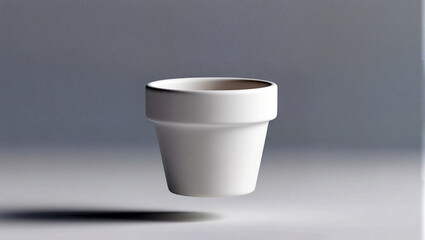 White pot stands out against a soft gray background