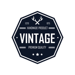 This vintage-inspired logo design showcases a hexagonal shape with antlers and bold typography emphasizing handmade products. It represents premium quality and adds a distinctive touch to branding.