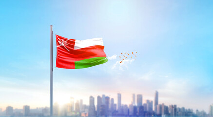 Oman national flag waving with skyline and buildings. Oman national flag for independence day.