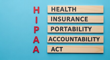 Obraz premium Health Insurance Portability and Accountability Act Acronym, High Angle Flat Lay on Blue Background