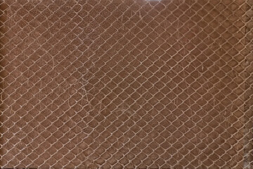 Dirty brown framed wire wall