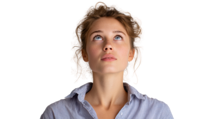 A young woman looking up thoughtfully against a white isolated background.