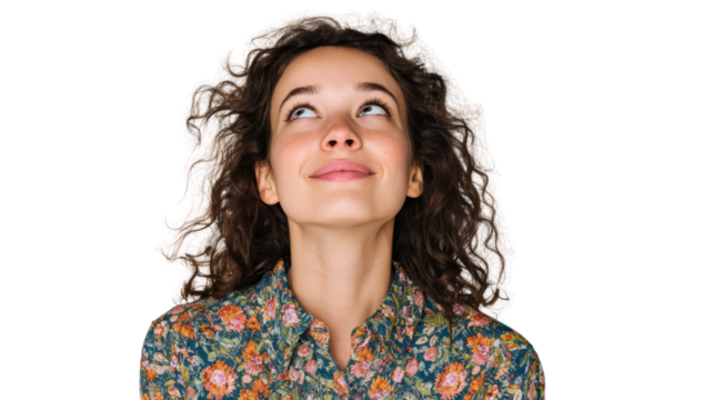 A young woman with curly hair looking up and smiling, surrounded by a floral shirt, isolated on white background.