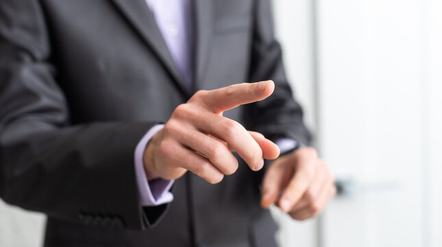 businessman touching an imaginary screen with clipping path isolated on white background
