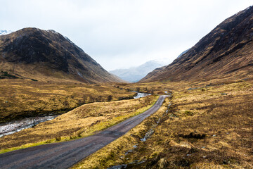 scottish highlands road way between mountains road to skyfall