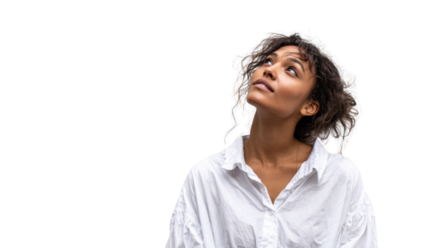 Young woman looking up with curiosity, wearing a white shirt against a transparent background.
