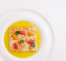 Unique dessert presentation with delicate fruits and syrup on plate