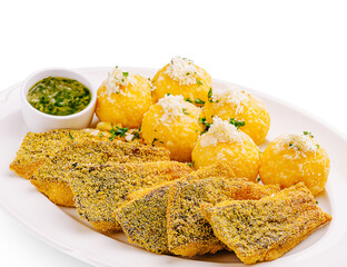 Delicious fried fish served with yellow plantain balls and dipping sauce