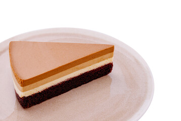 Layers of decadent dessert on a minimalist plate showcasing rich flavors