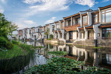 Tranquil Riverside Villas Surrounded by Lush Greenery and Reflective Waters