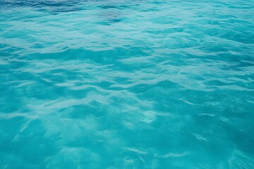 Tropical ocean with gradient turquoise water, shallow reef texture, minimal wave motion